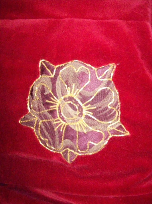 Applique and gold-couched rose. Ysambart was on the Queens Guard at the time.