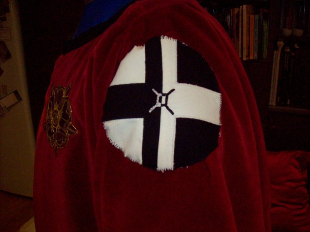 Applique and split stitch badge for the left shoulder of Ysambart's tabard. It's the House Burbage device.