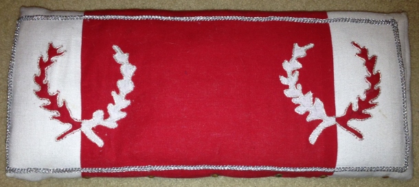 The Baronial Kneeler cover that I designed. It was an existing kneeler that was refurbished into Baronial colours, made with some assistance from others. Frame donated by Mistress Mathilde and Sir Stephen.