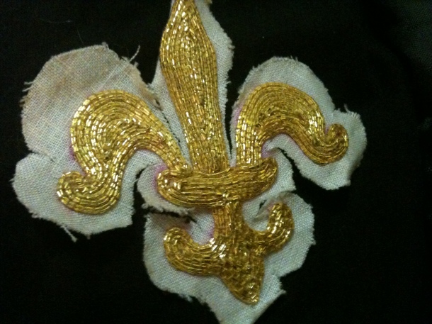One of two padded goldwork fleur de lis that I made from Mistress Contarina Cassagrande's goldwork class. I gifted them both to Kitan von Faulkenberg and Alessia de Cheval Blanc.