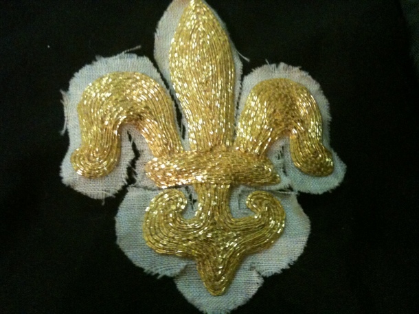 The secondf of two padded goldwork fleur de lis that I made from Mistress Contarina Cassagrande's goldwork class. I gifted them both to Kitan von Faulkenberg and Alessia de Cheval Blanc.