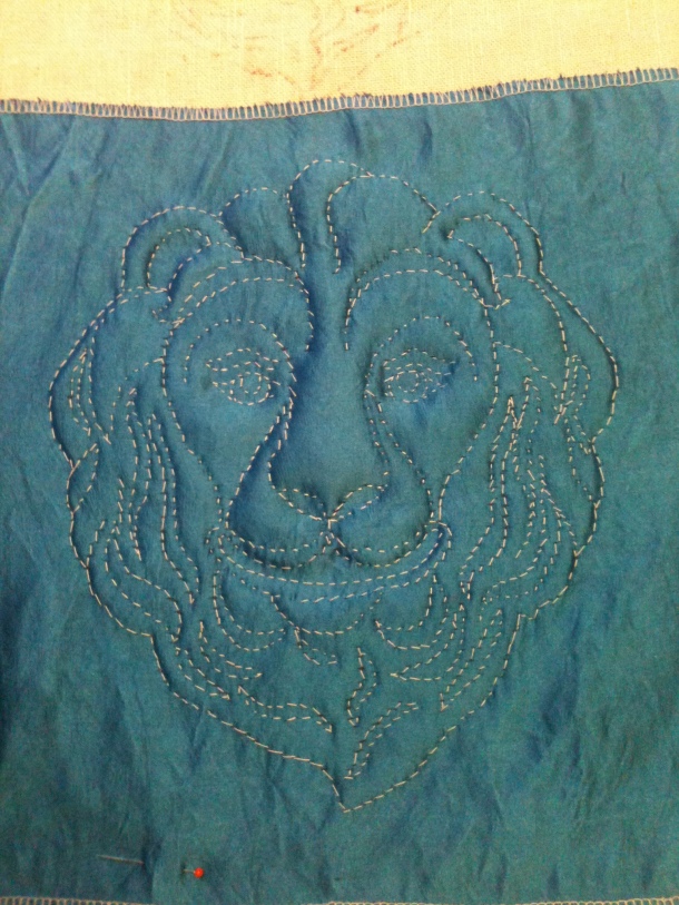 Sewn outline for a lion on House Burbage's Pride of Lochac Banner (work in progress).