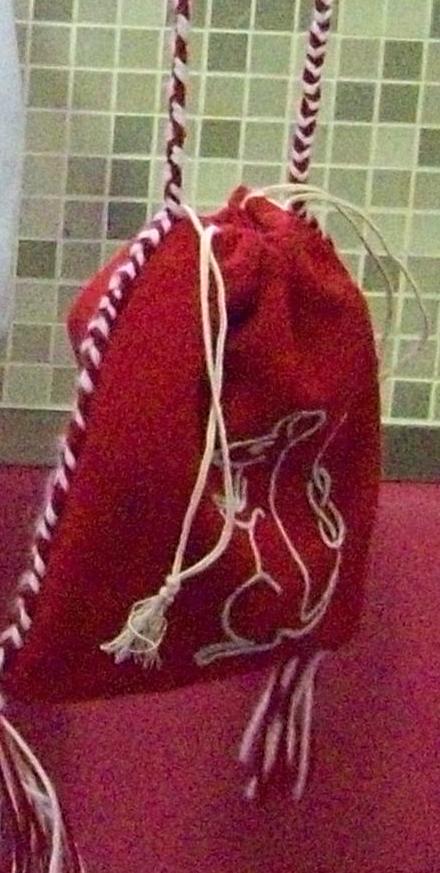 The first of two mouse pouches I made using wool, embroidered with chain stitch. I also wove the cords and made the tassels.
