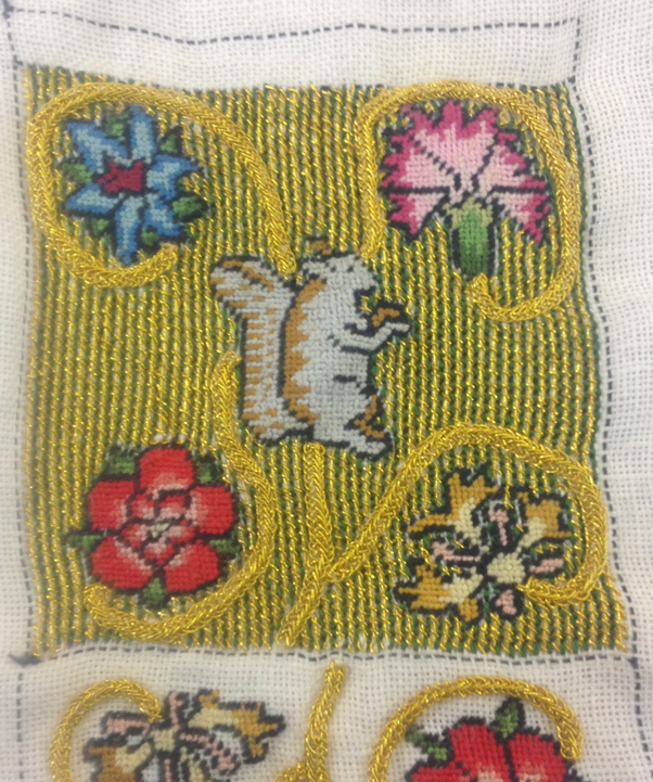 Tramming and silk backstitch are finished in the background of the squirrel half of the sweet bag.