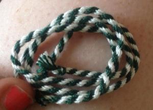 8 loop fingerloop braid made using 15th century instructions documented by Benns & Barrett (2005 - instruction number 25)