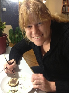 Me gilding the background of gingerbread I made from an adaptation of a 16th century recipe