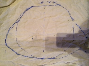 Figure 1: Caul mockup one – the 30cm circle is from my Italian caul pattern. I flattened the top (that sits on the forehead) and made the sides triangular.