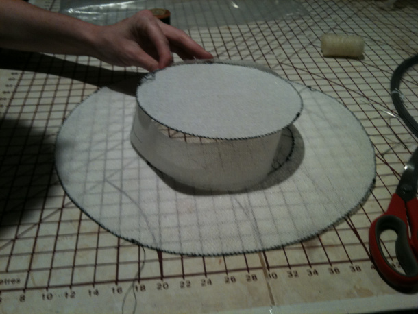 Milliners wire is couched around the inside and outside of the brim, and around the crown, by Ceara Shionnach.