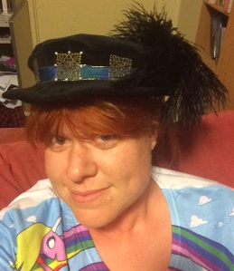 Figure 14: Me, wearing the hat to demonstrate the front, which is indicated by the pearls around the filigree square.