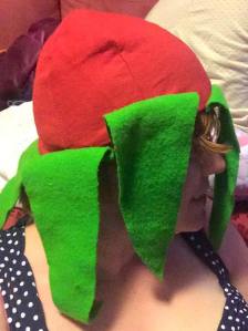 Six, green, traingular panels were cut out of wool and attached to the skullcap, by THL Ceara Shionnach, Jan-Feb 2015.