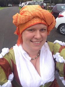A closer view of the fringed turban. I borrowed a partlet and a silk belt from Baroness Ginevra for the occassion. Photo by Ceara Shionnach, April 2015.